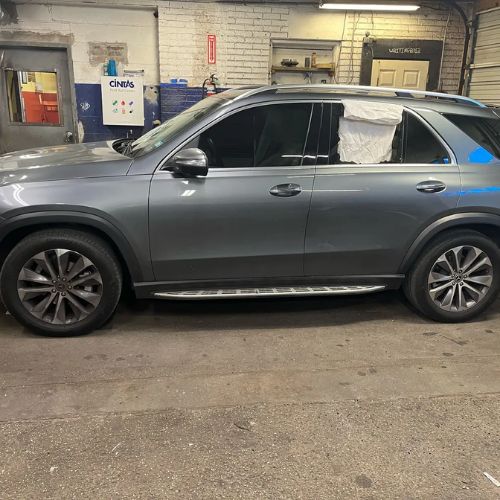 Technician performing windshield replacement in Cicero, IL with ADAS and HUD systems protected.